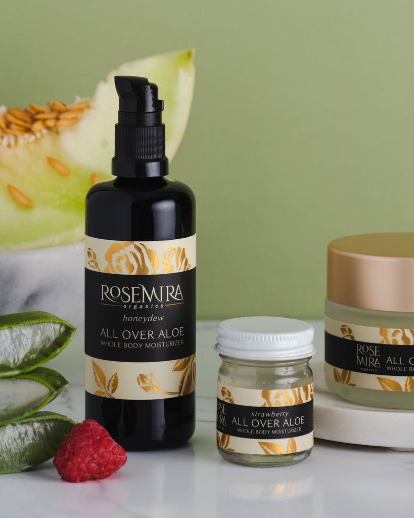Three different Rosemira bottles with aloe and fresh fruit