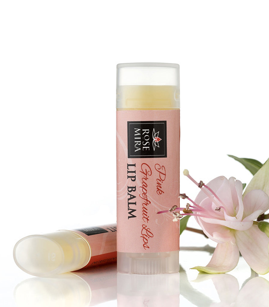Pink grapefruit organic lip balm with pink label and light pink flower