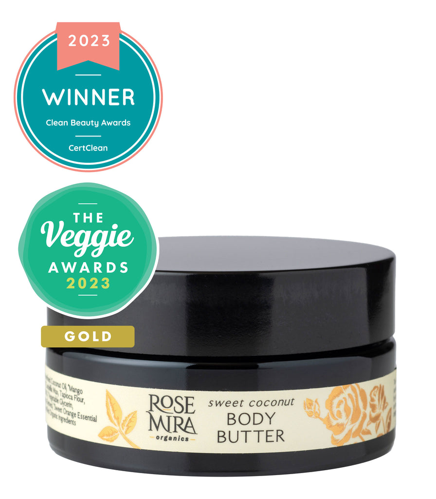 Large violet glass container of body butter with Clean Beauty Awards and Veggie Awards winning badges