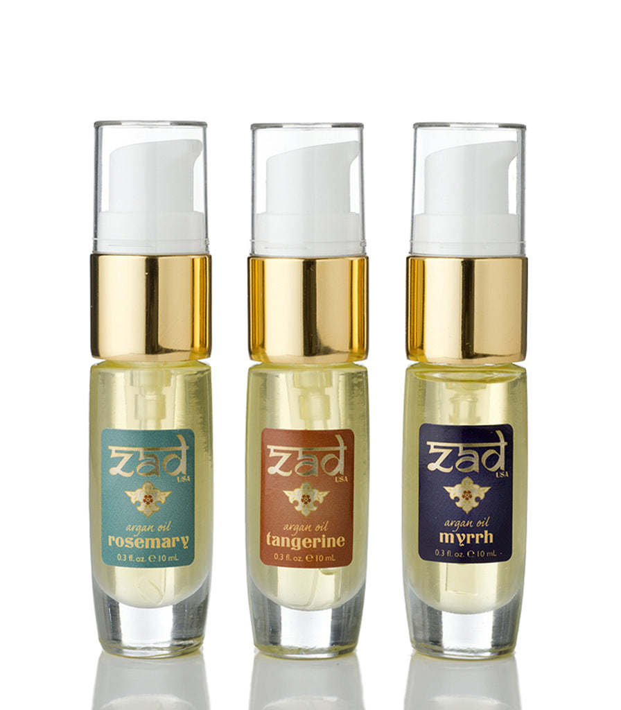 The three bottles in a Zad Argain Oil Hair Kit are rosemary, tangerine, and myrrh