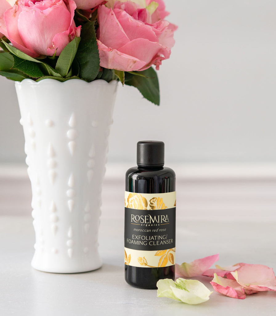 Rosemira Moroccan Red Rose Cleanser with a bouquet of pink roses.