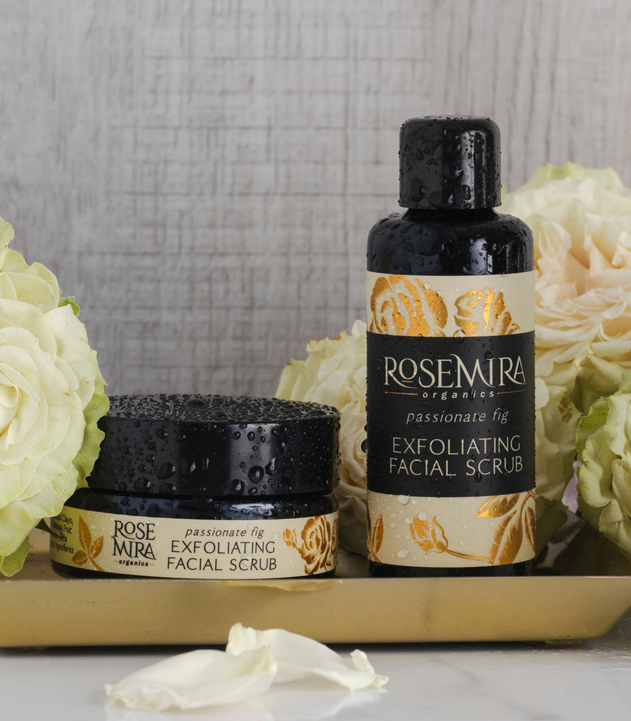Passionate Fig Exfoliating Facial Scrub on a gold tray with white roses