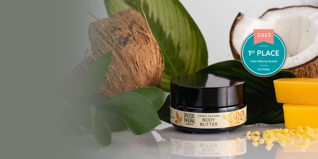 Sweet Coconut Body Butter with coconut halves, green leaves, and first place badge.