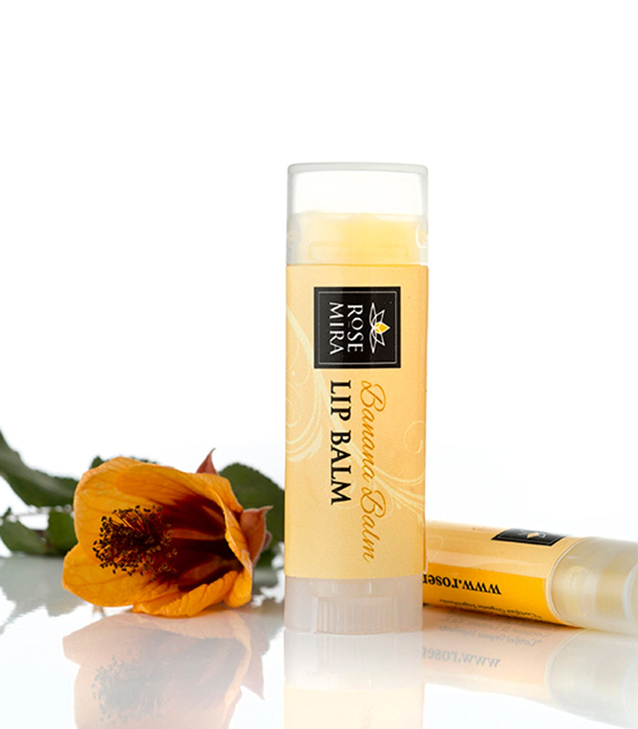 Banana organic lip balm with yellow label and orange flower