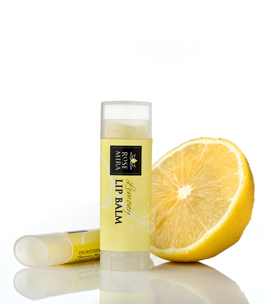 Lemon organic lip balm with yellow label and lemon half