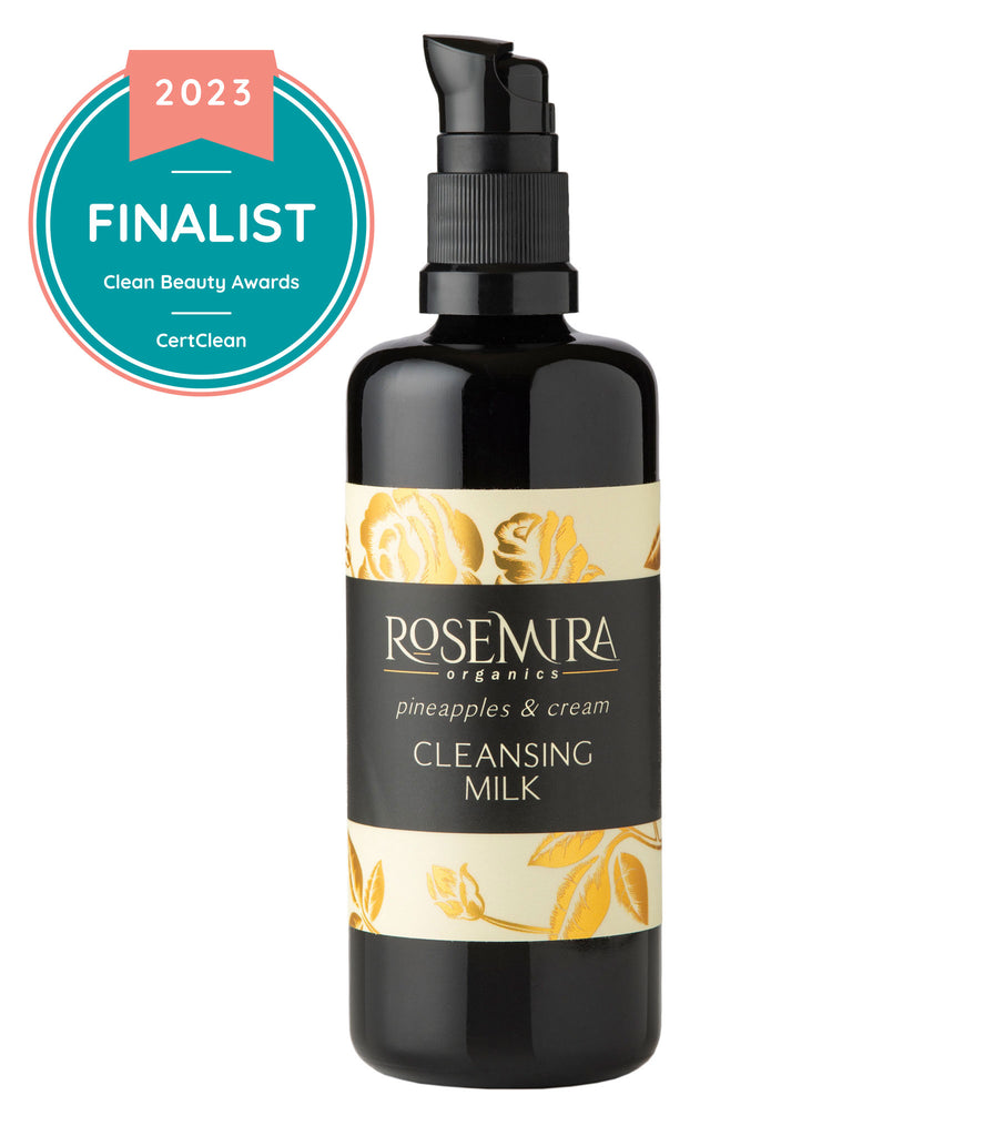 A black bottle of Rosemira Pineapples and Cream Cleansing Milk with Clean Beauty Awards graphic