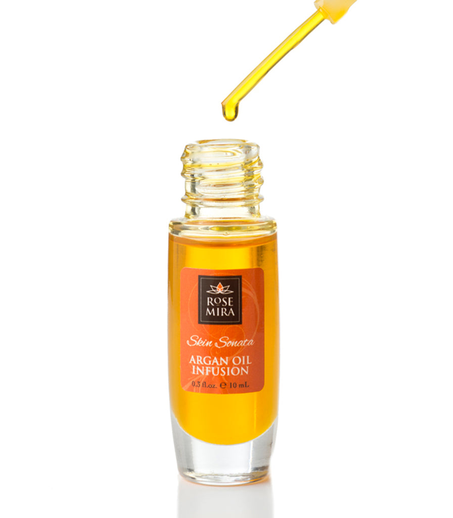 An open clear bottle of Skin Sonata Argan Oil Infusion showing the serum color