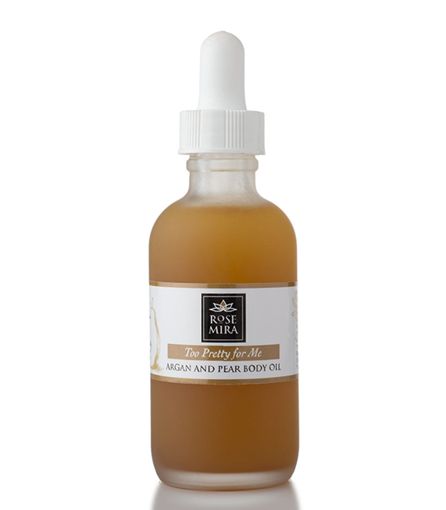 Too Pretty For Me Argan and Pear Body Oil in clear glass with white label.