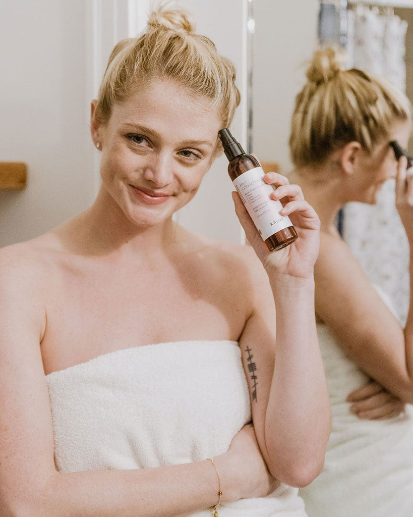 Applying Rosemira toner to refresh and balance skin for a glowing complexion