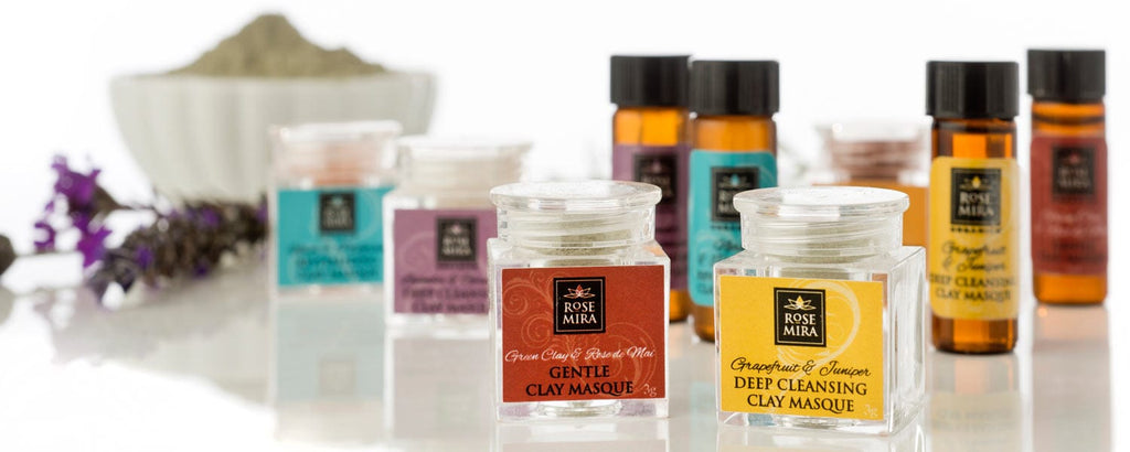 A row of Rosemira Organics samples in clear and amber bottles.