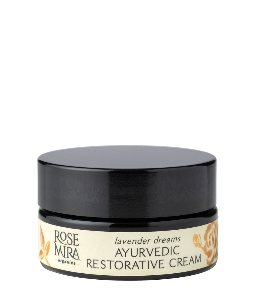 A bottle of Lavender Dreams Restorative Cream with cream and gold label 