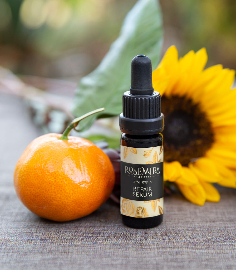 See Me C Repair Serum with a clementine and sunflower bloom.